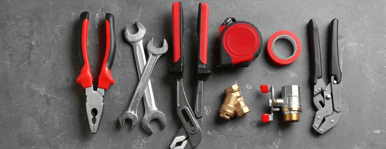 Flat lay composition with plumber's tools and space for text on gray background.jpg